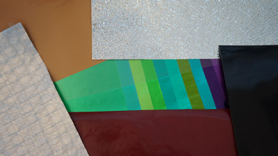 Lacquered and embossed aluminium foils and laminations.